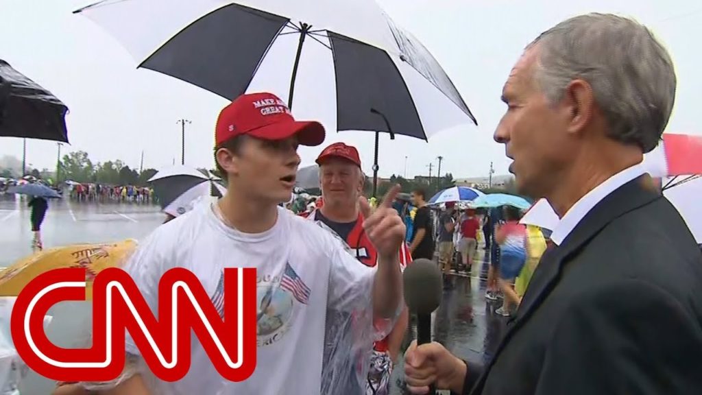 CNN reporter talks to conspiracy theorists at Trump rally