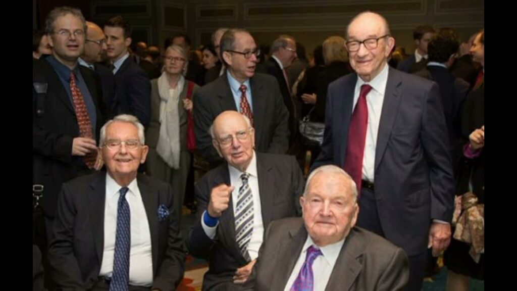 David Rockefeller Federal Reserve  Alan Greenspan standing and Paul Volcker seated